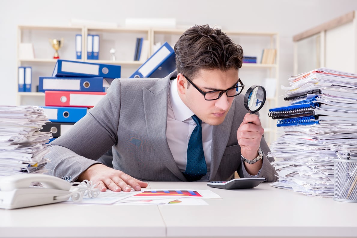 Male Businessman with Magnifying Glass